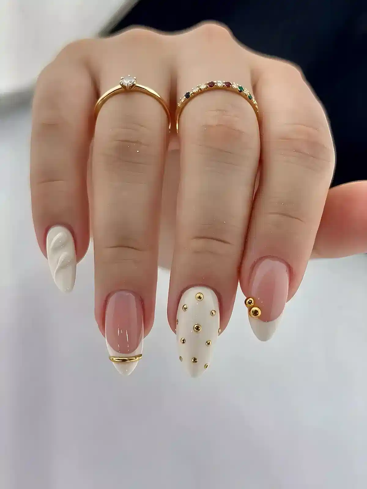 Mixed white accents with gold studs and French-tip details