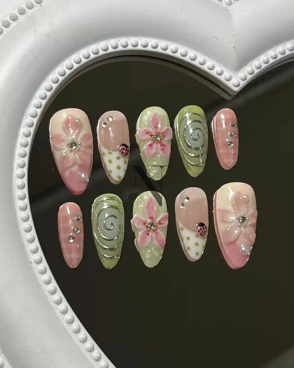Pink and green floral set with spiral detail and ladybug motif