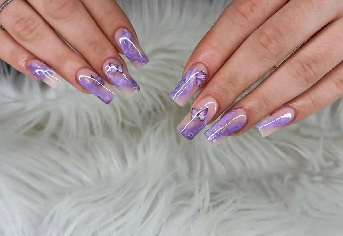 Translucent nude-and-purple marble square nails