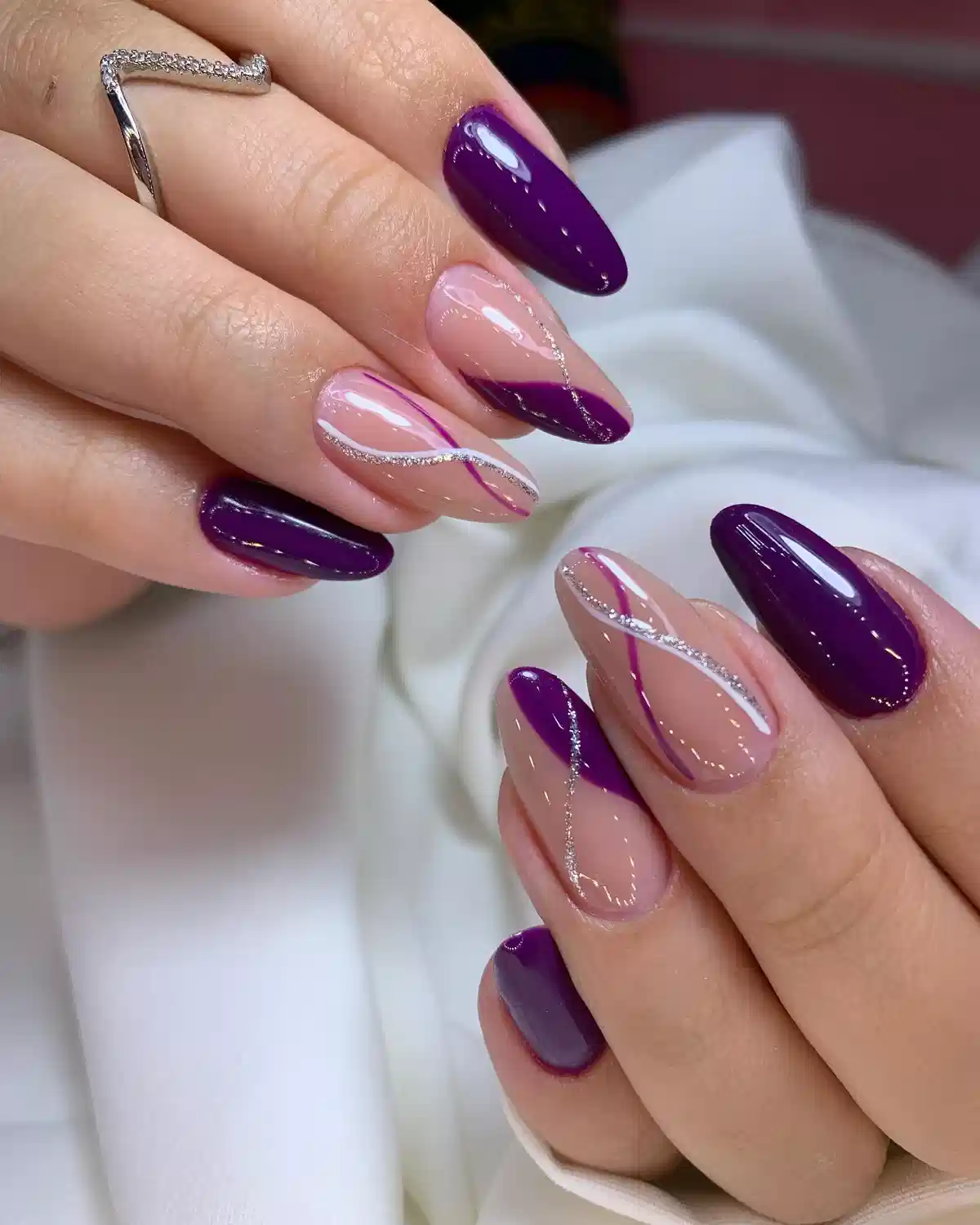 Deep purple solids with nude-and-diagonal purple accents