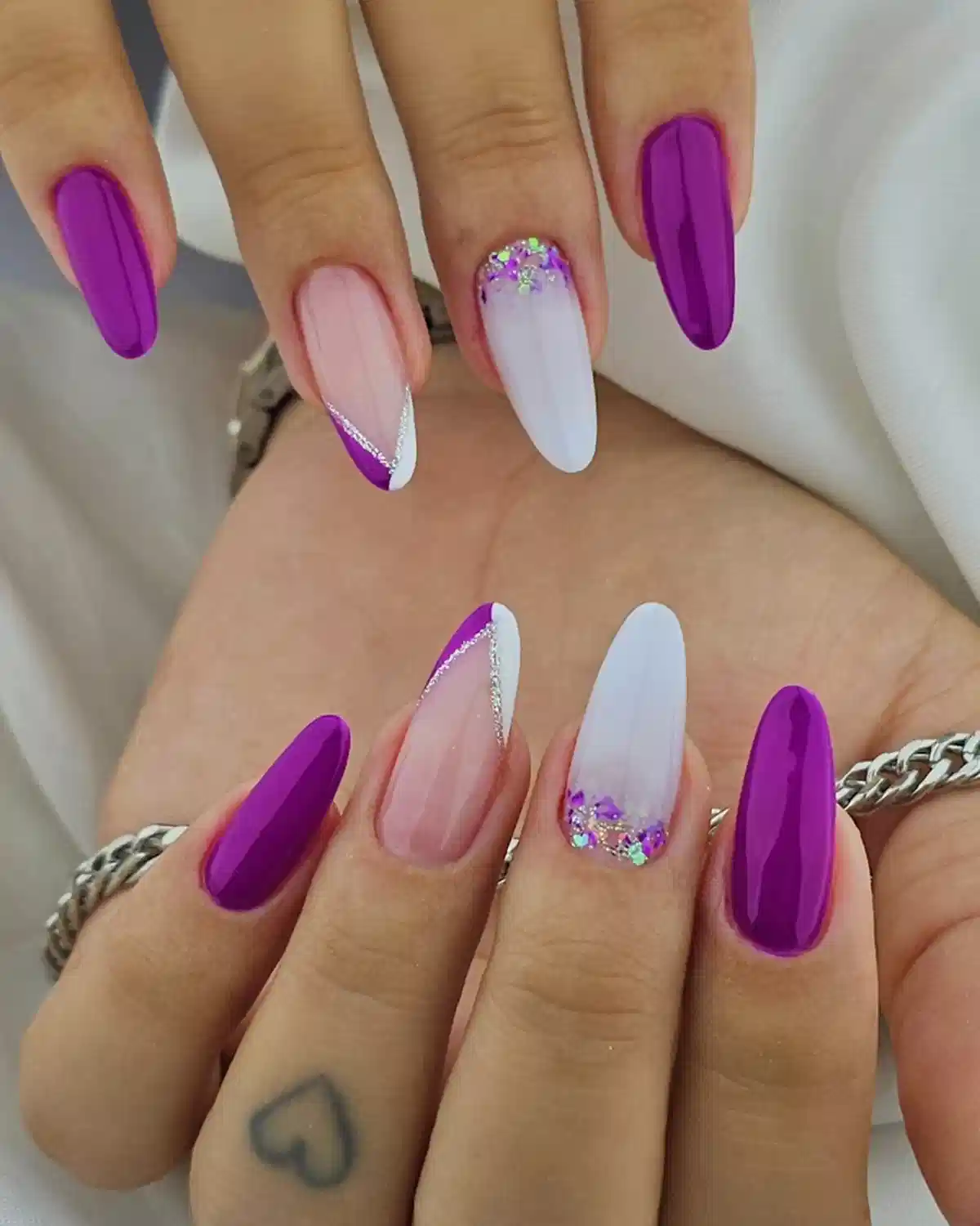 Bright purple solids with white glitter accents and diagonal details