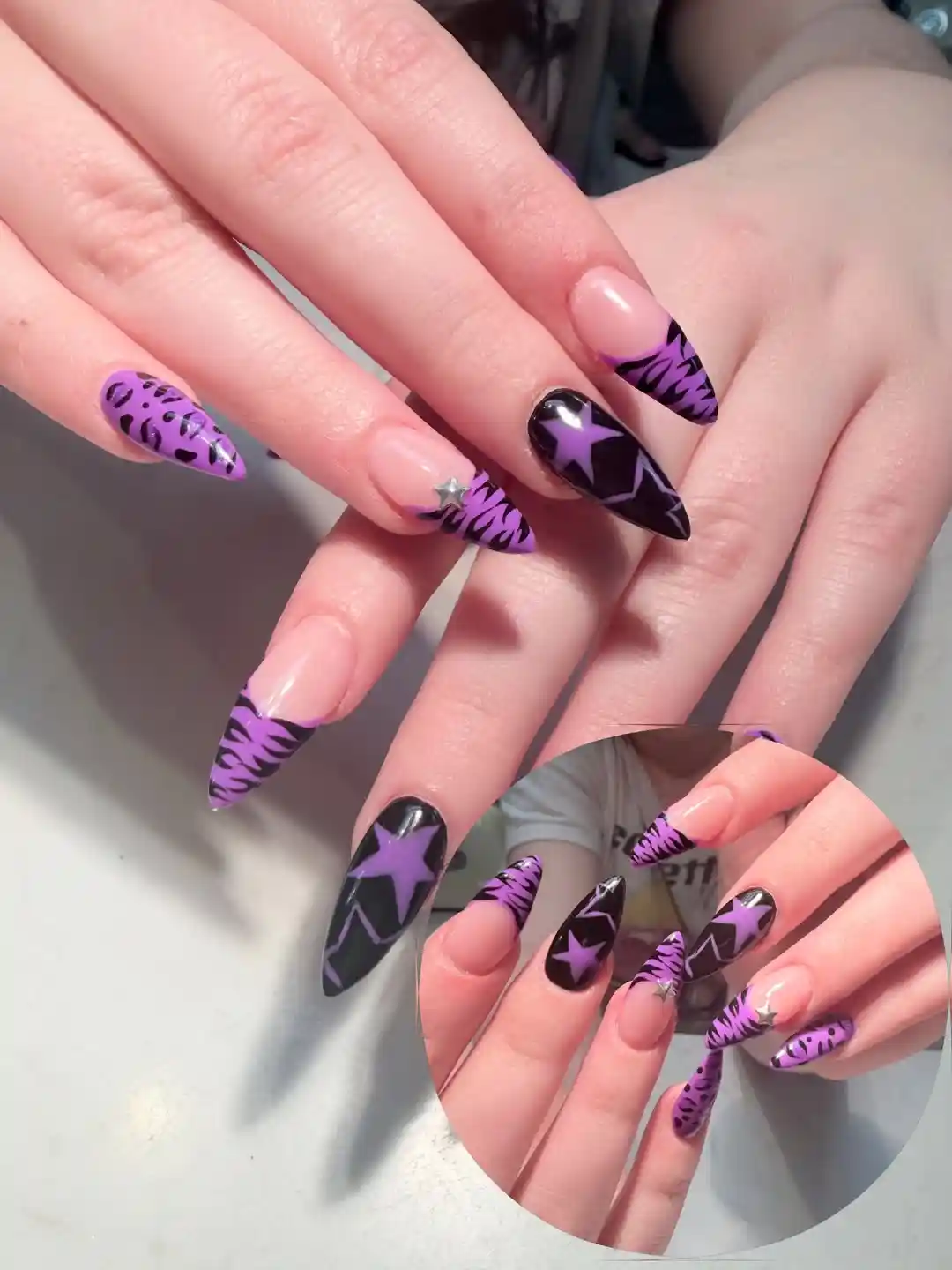 Nude Base with Purple-Black Zebra Tips and Star Accent Nail