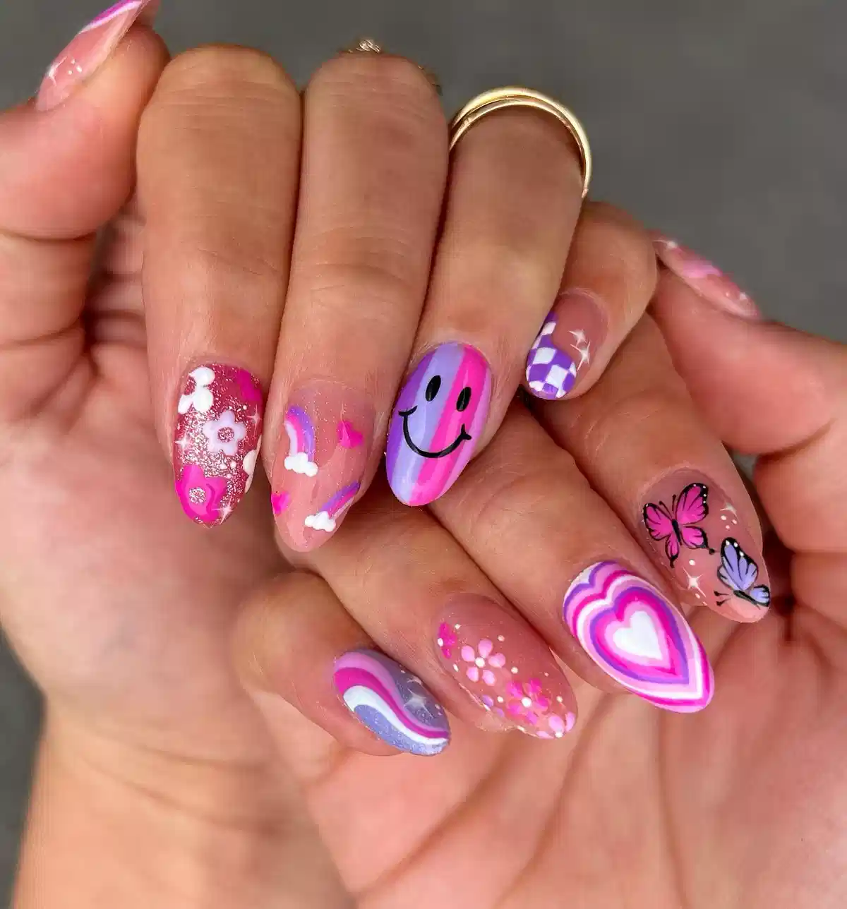 Mixed pink-and-purple icons: smiley, butterflies, hearts, and checks
