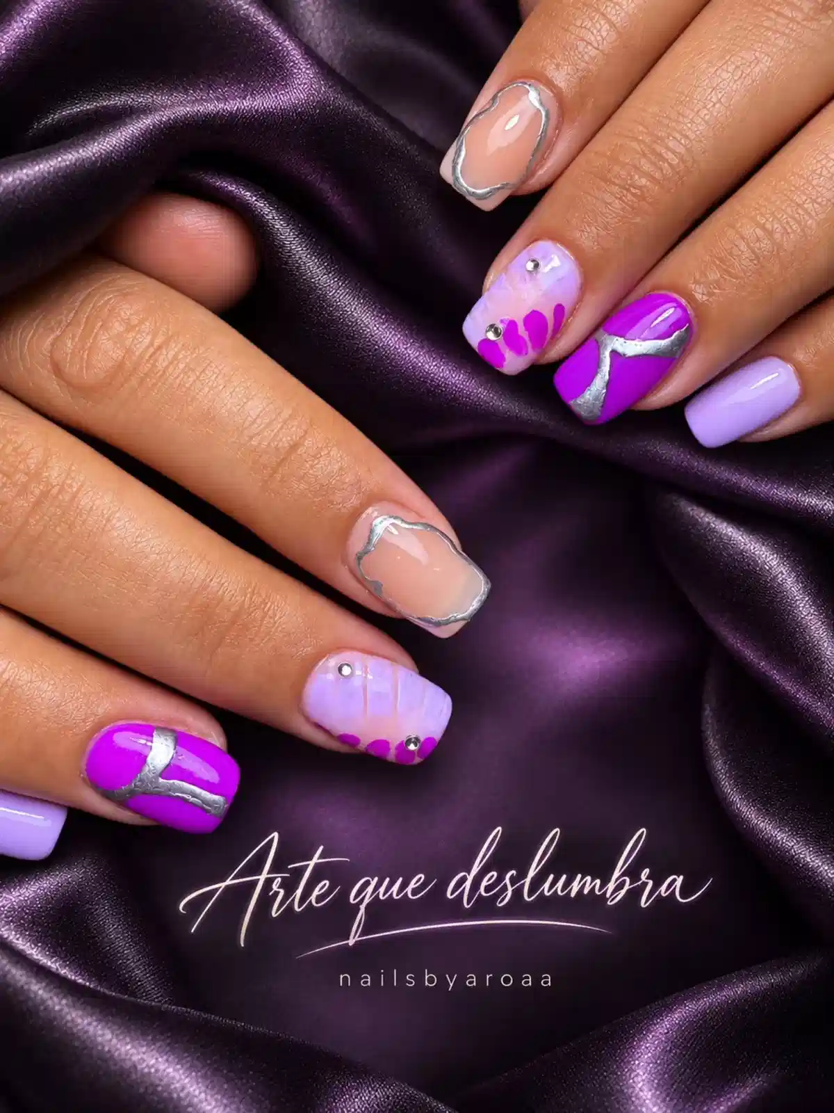 Bright purple and lavender mix with silver curves and studs