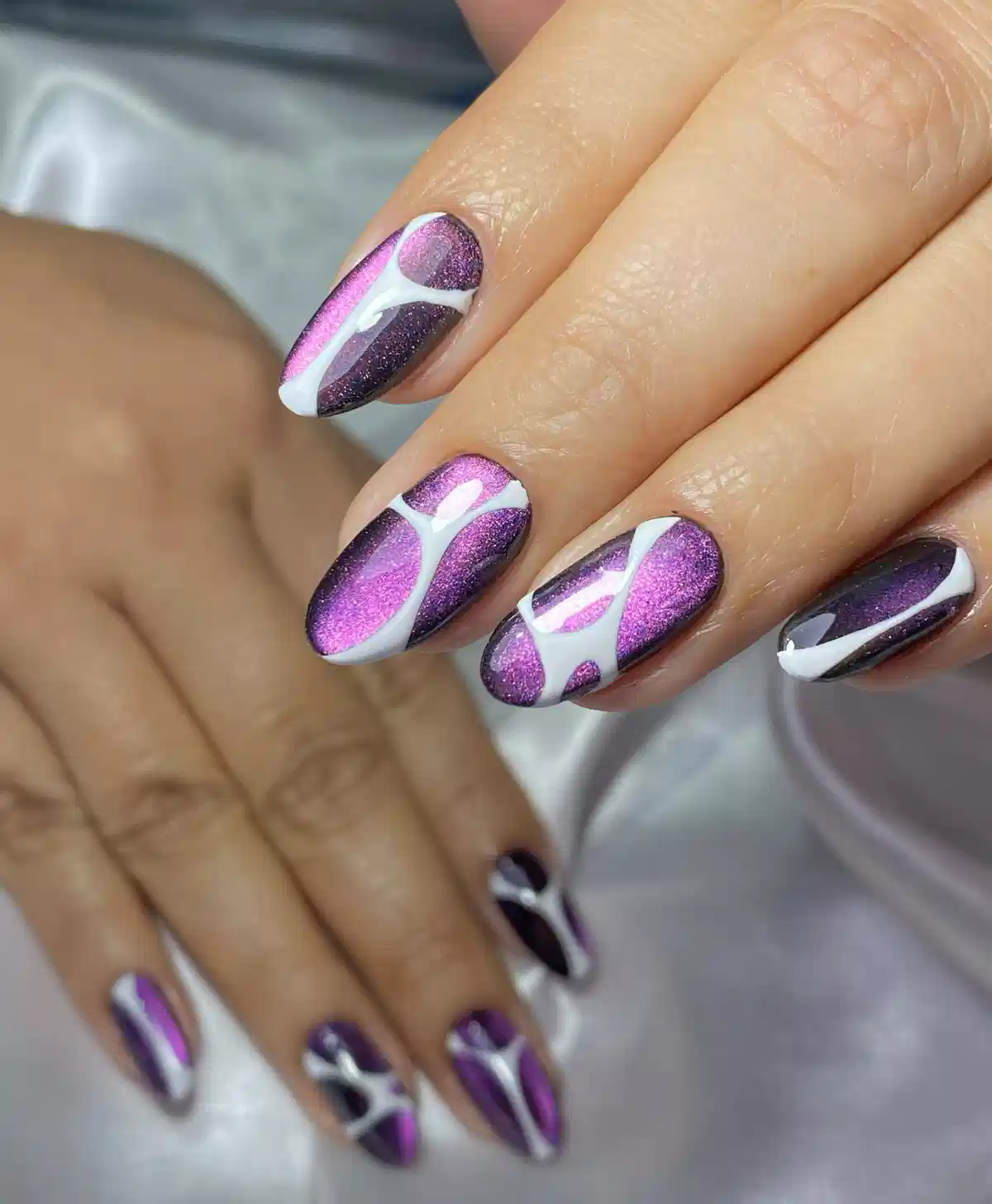 Metallic purple gradient with white abstract curves
