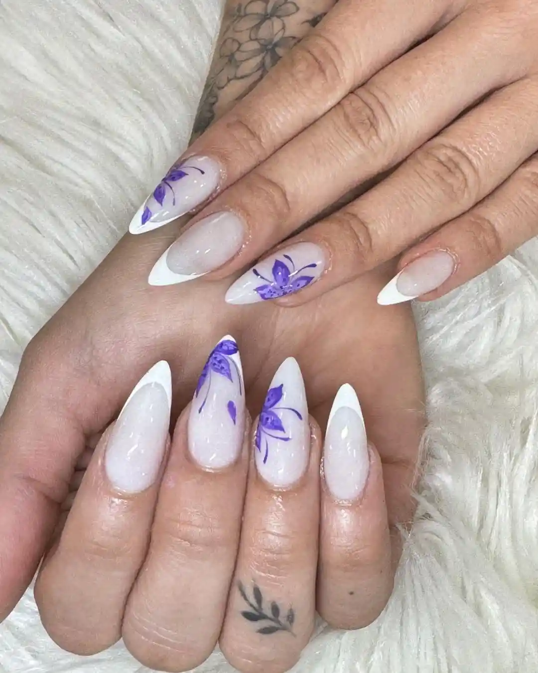 Milky white French tips with purple floral linework
