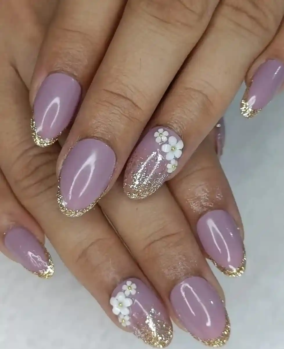 Soft lavender with gold glitter tips and white floral accent