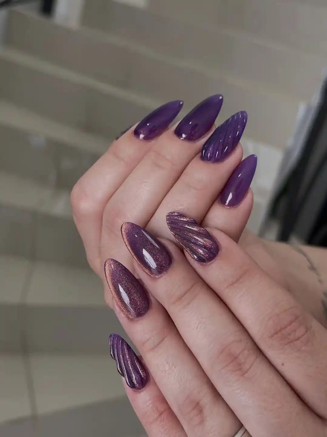 Purple cat-eye mix with copper shimmer and ribbed texture accents