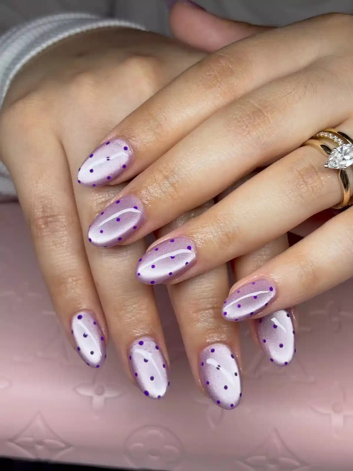 Pearly lavender nails with purple polka dots