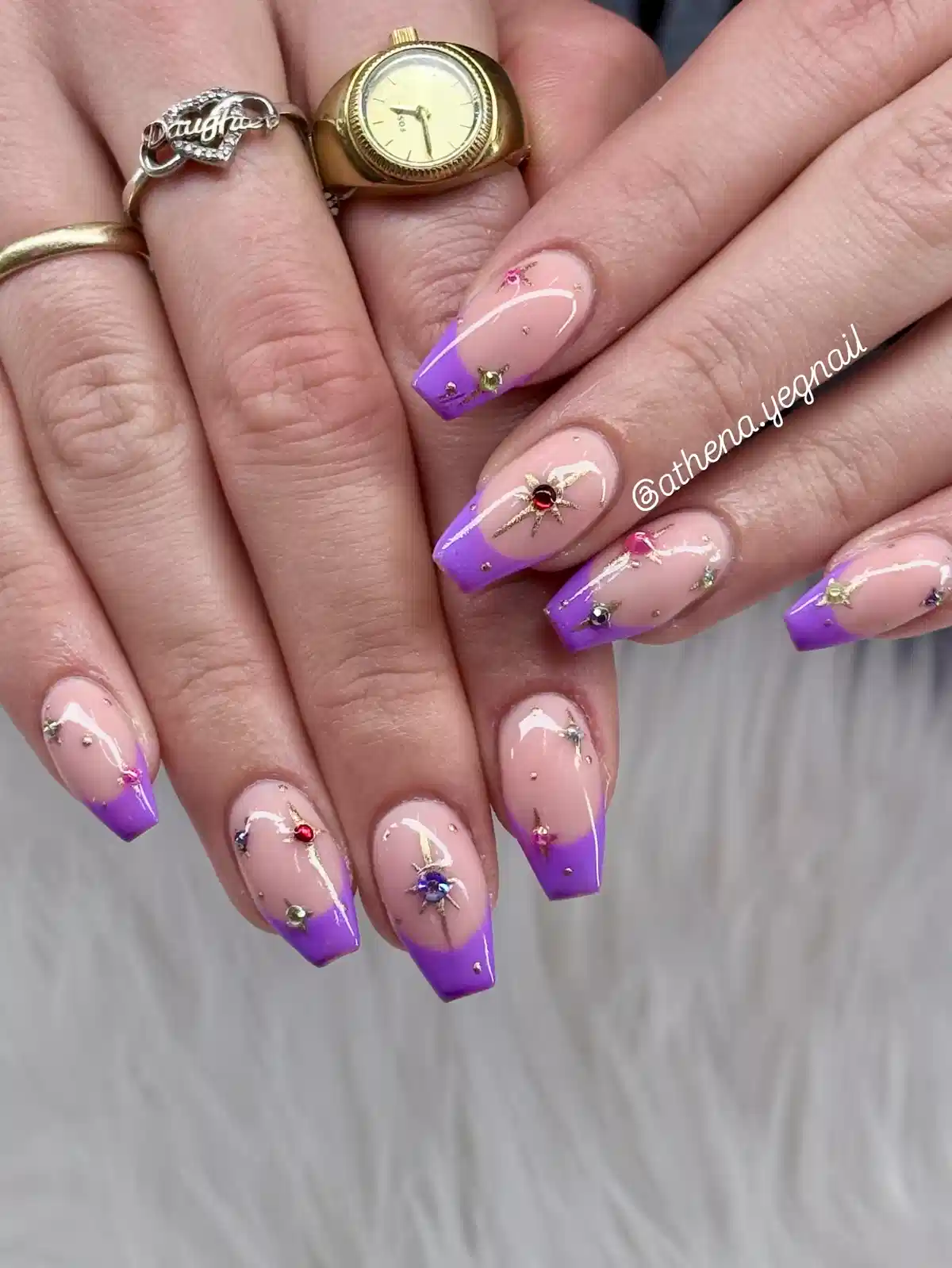 Purple ombré French tips with rhinestones and starburst detail