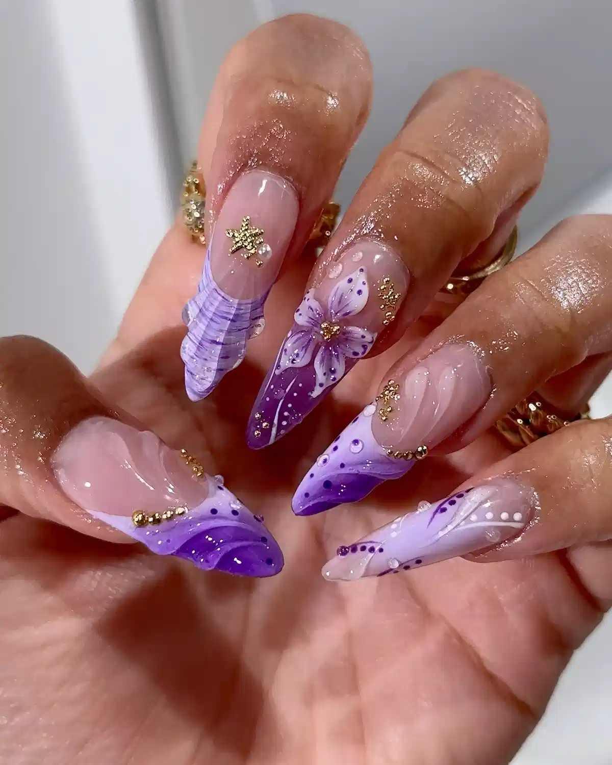 Embellished purple gradients with floral centerpiece