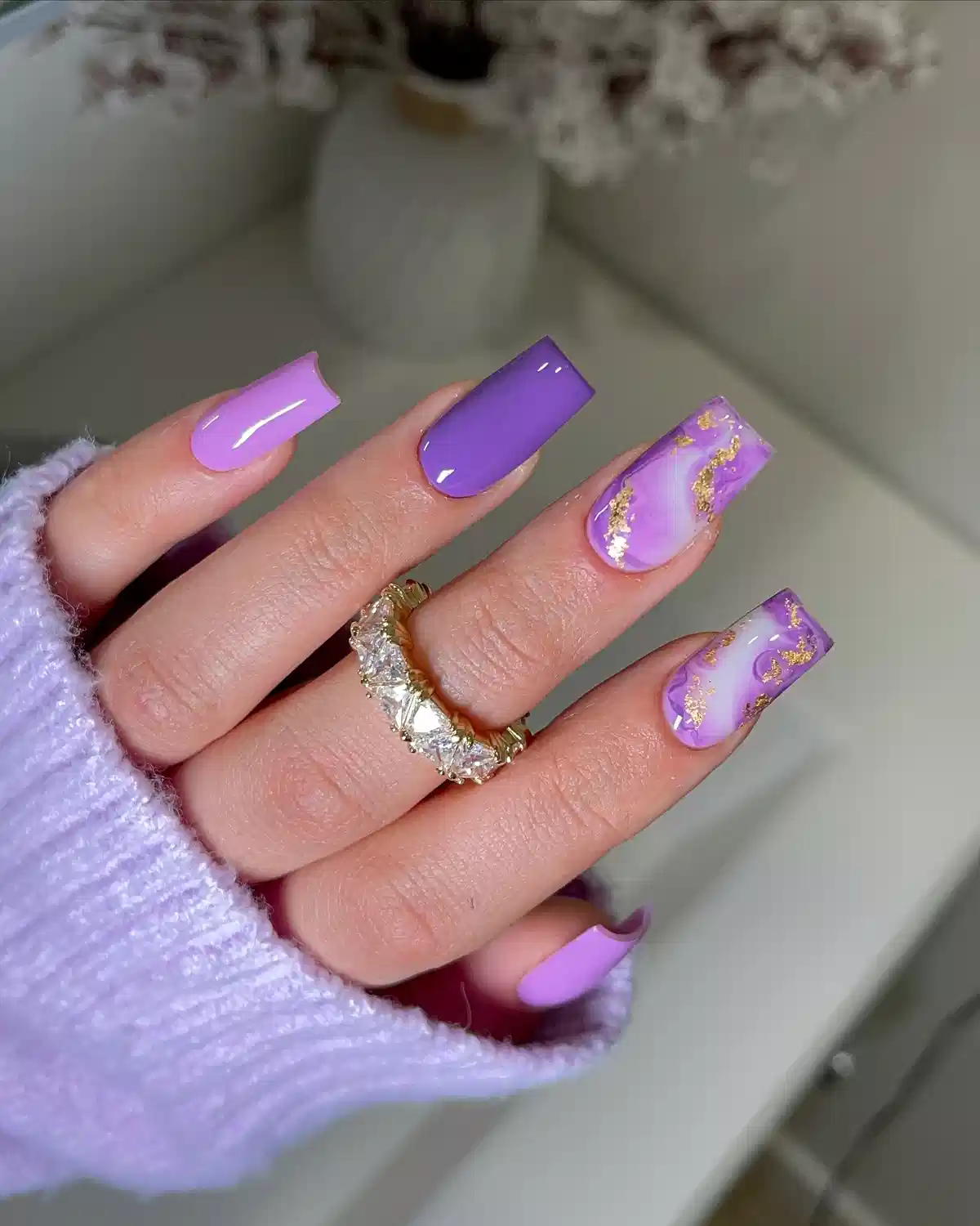 Purple solids with marbled gold-accent nails