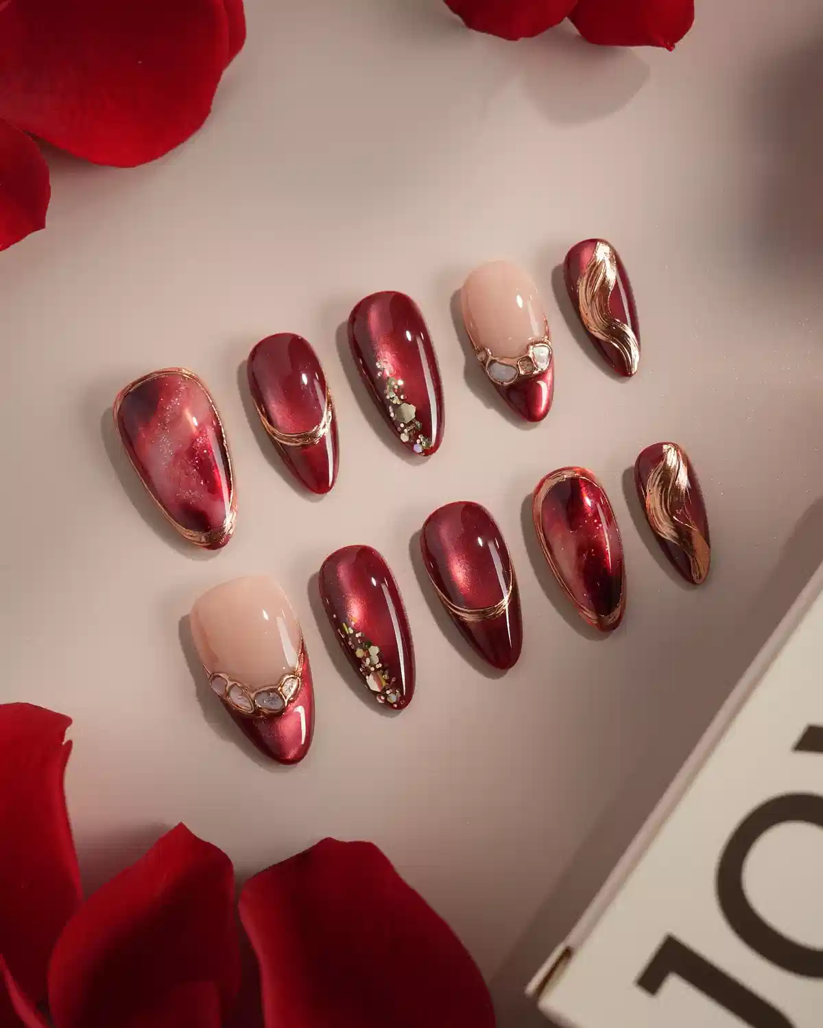 Metallic red and nude set with gold curves and gem clusters