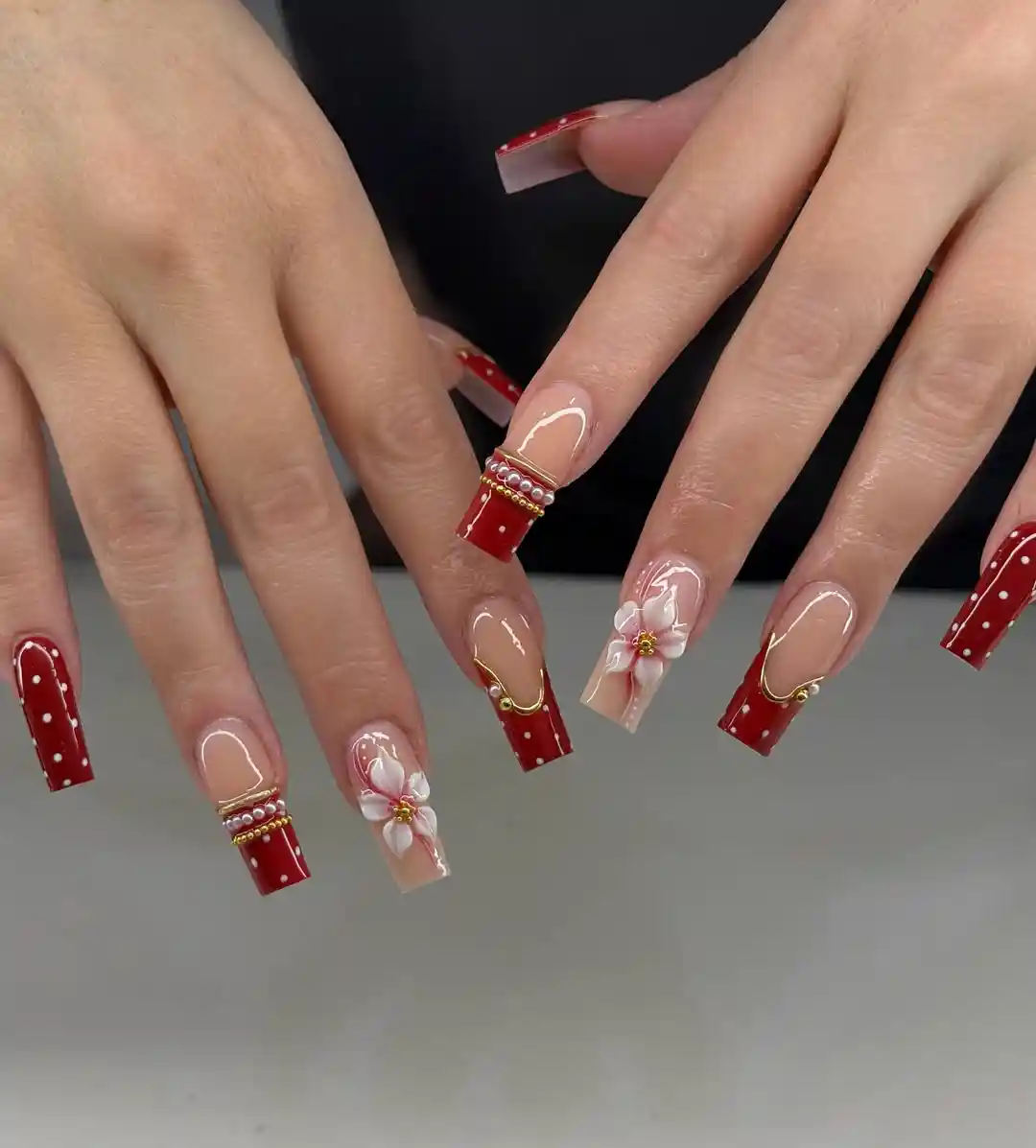 Red polka-dot French tips with 3D white flowers
