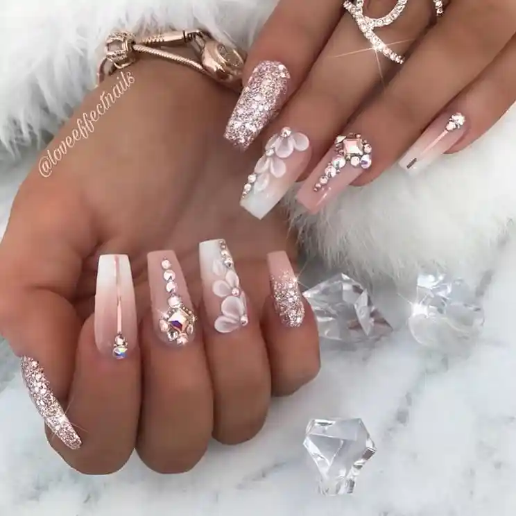 Coffin nails with rose-gold glitter, rhinestones, and 3D flowers