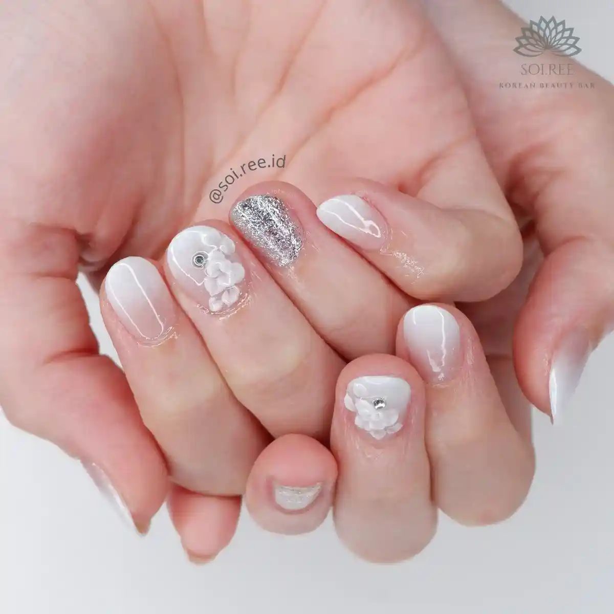 Milky white set with silver glitter accent and raised white flowers