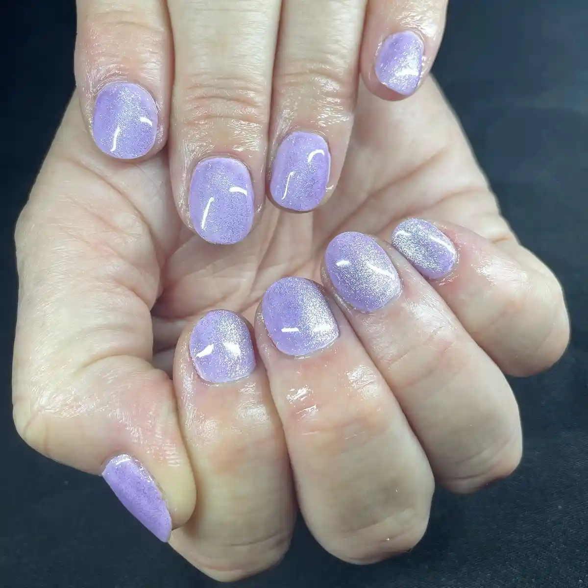 Pale lavender shimmer on short rounded nails