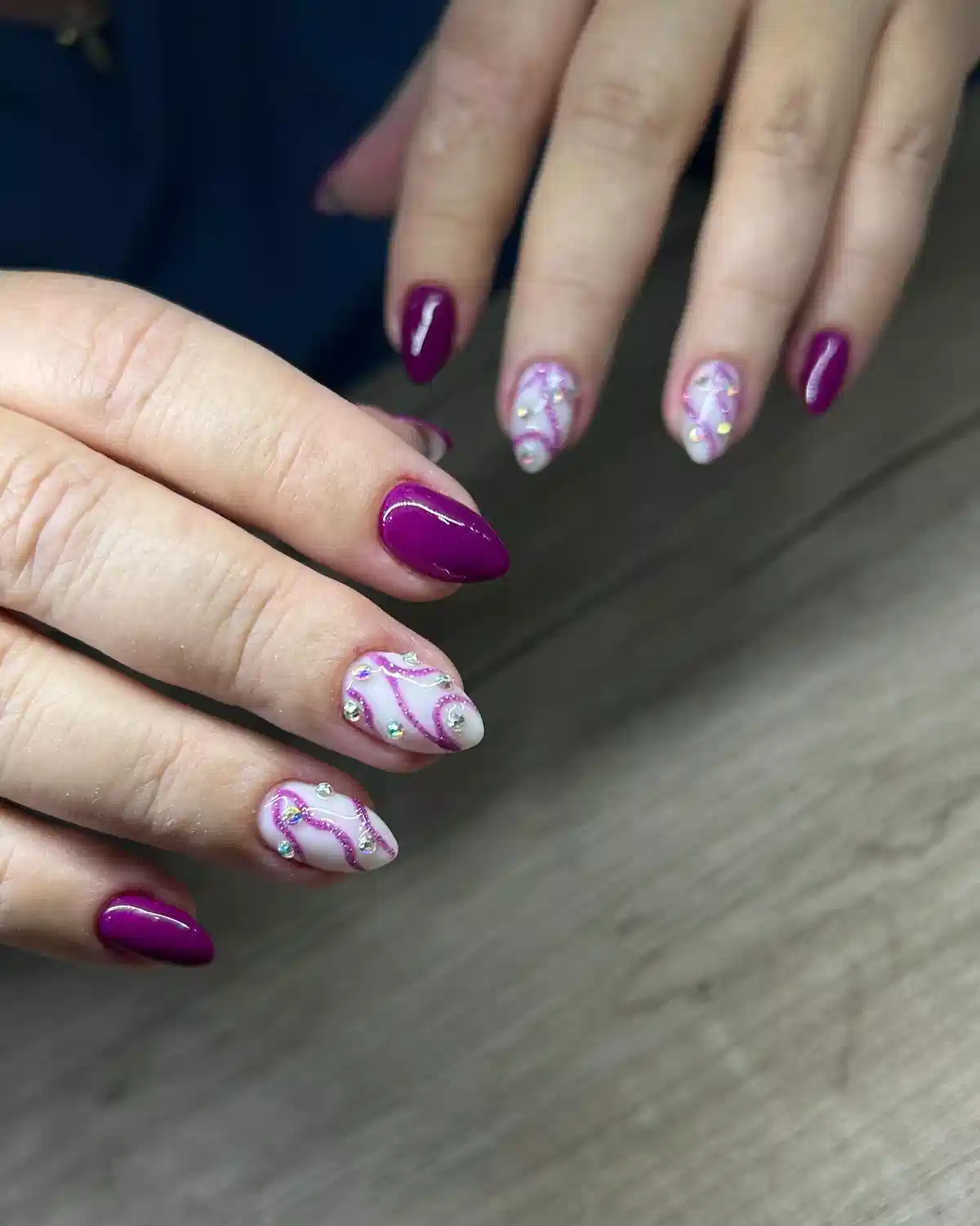 Deep purple solids with gem-studded swirl accents